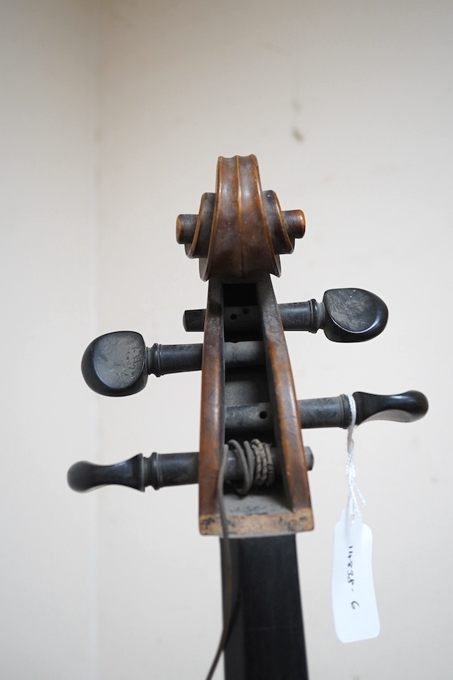 A late 19th century small cello, unsigned and without label inside body, stamped inventory number 769, length of back 62cm. Condition - poor to fair